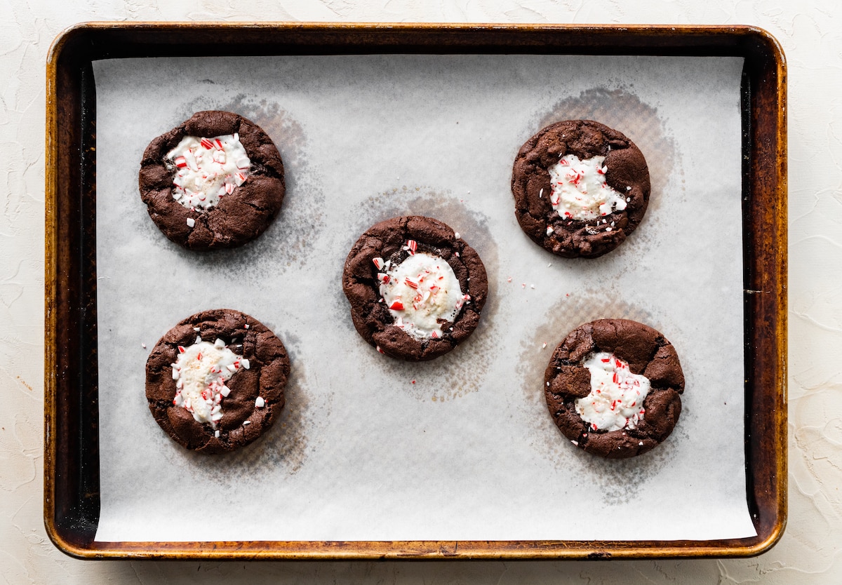 peppermint mocha marshmallow cookies on baking sheet with parchment paper. 