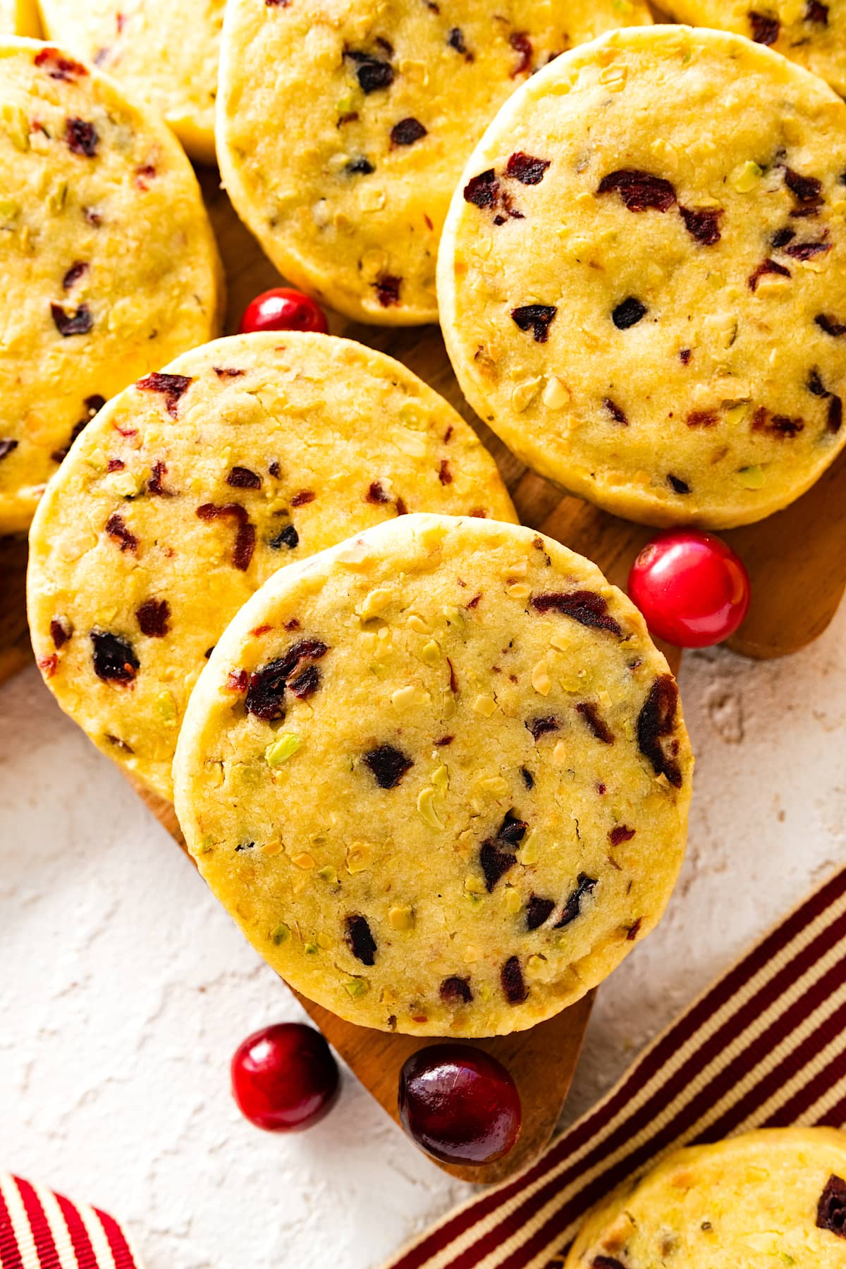 close up of cranberry orange pistachio shortbread cookies. 