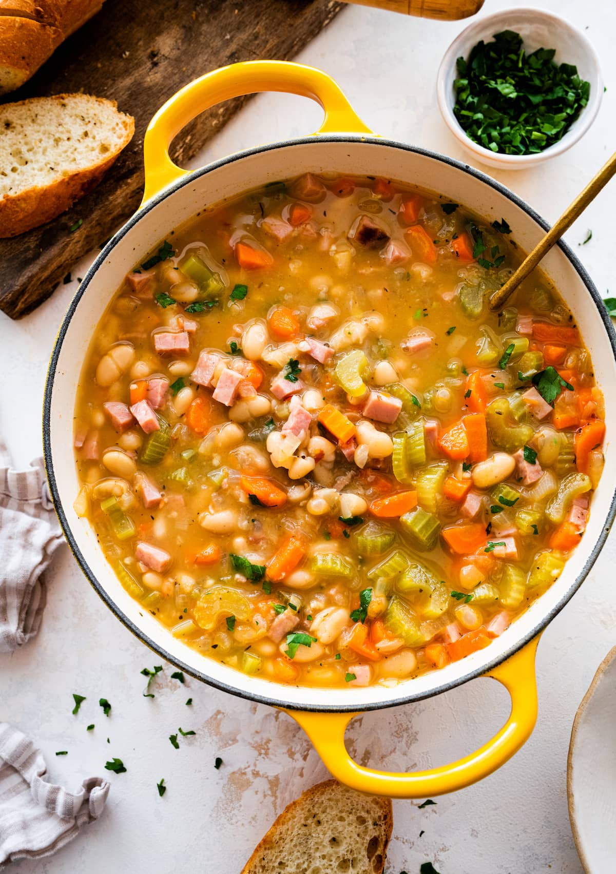 ham and bean soup in large pot with ladle. 