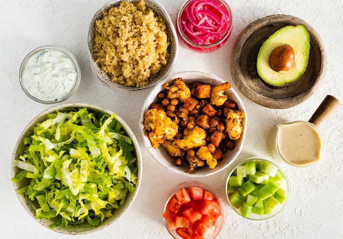 ingredients to make roasted cauliflower sweet potato chickpea bowls. 