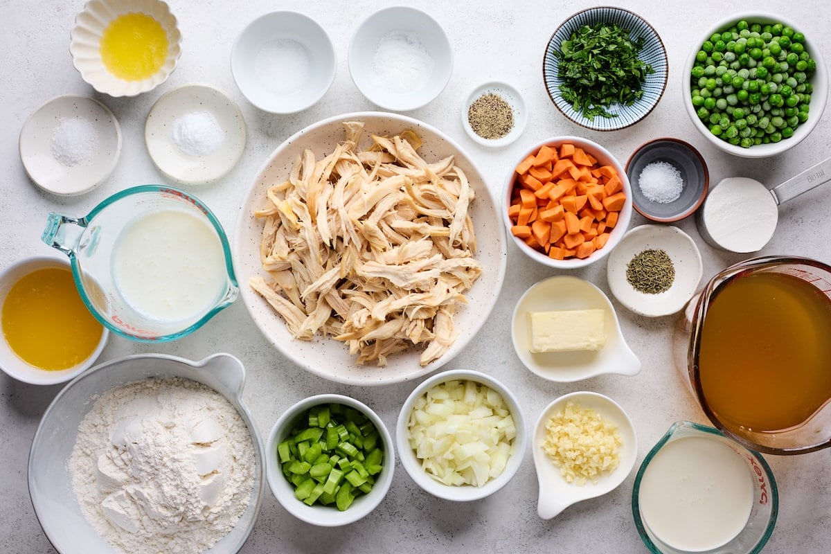 ingredients in bowls to make chicken pot pie with biscuits. 