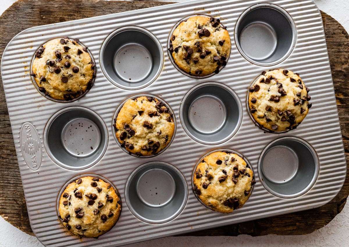 chocolate chip muffins in muffin tin. 