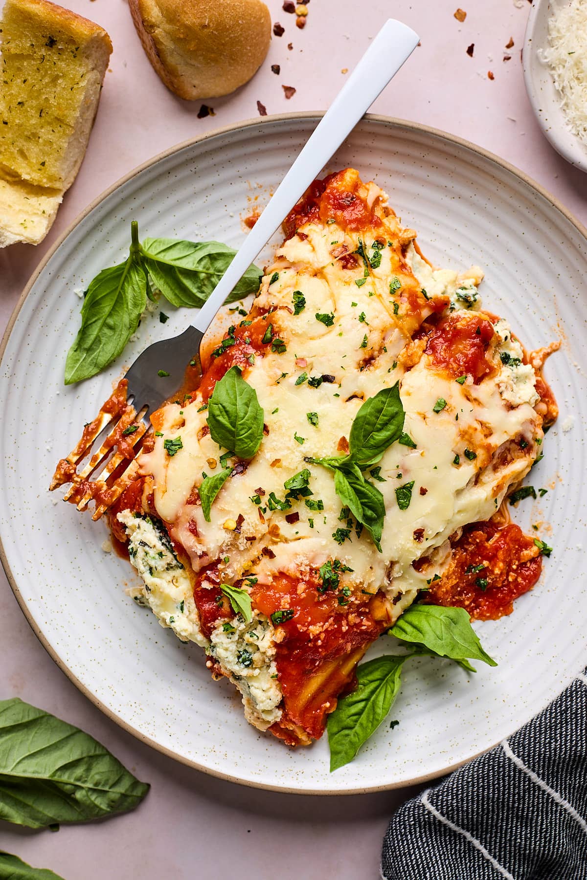manicotti on plate with fork. 