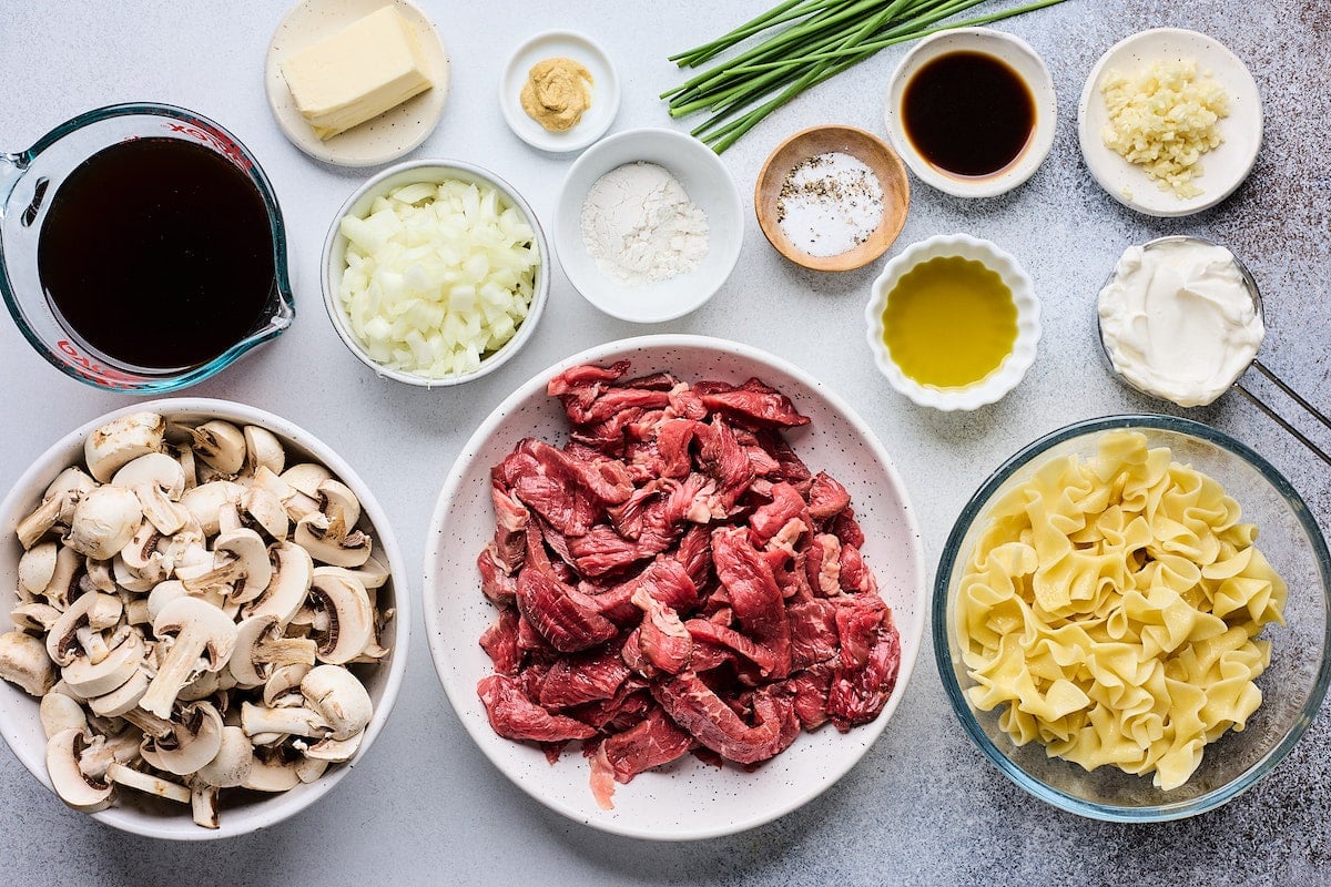 ingredients in bowls to make beef stroganoff.