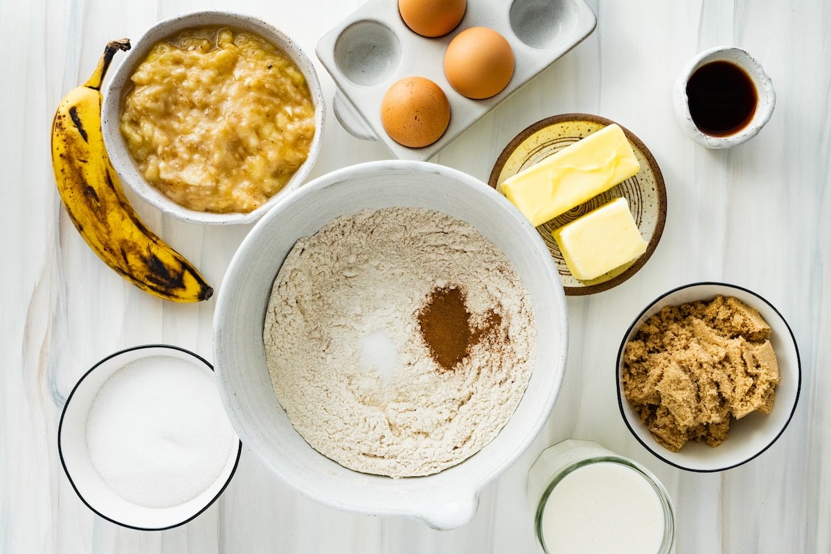 ingredients in bowls to make banana cake. 