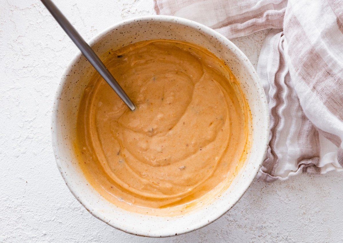 chipotle dressing in bowl with spoon. 