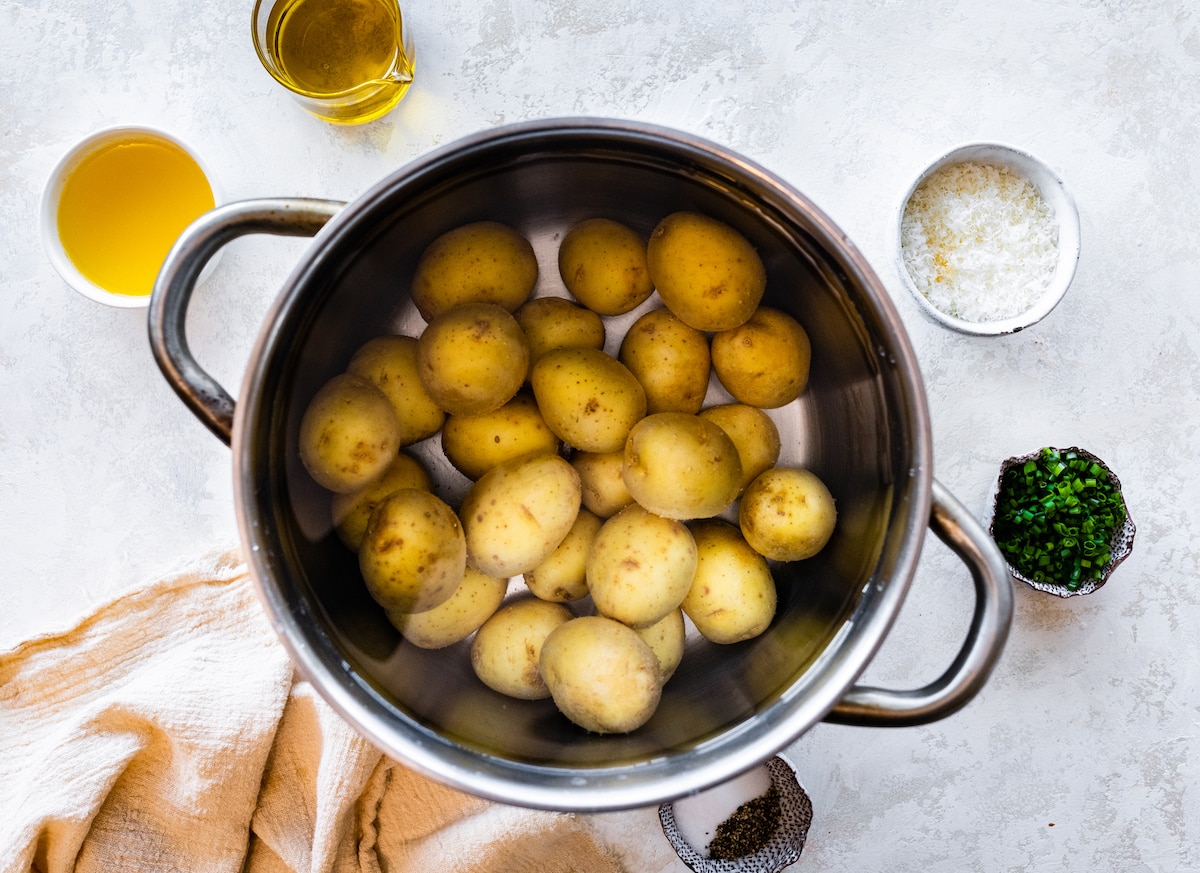 potatoes cooking in pot of water to make smashed potatoes. 