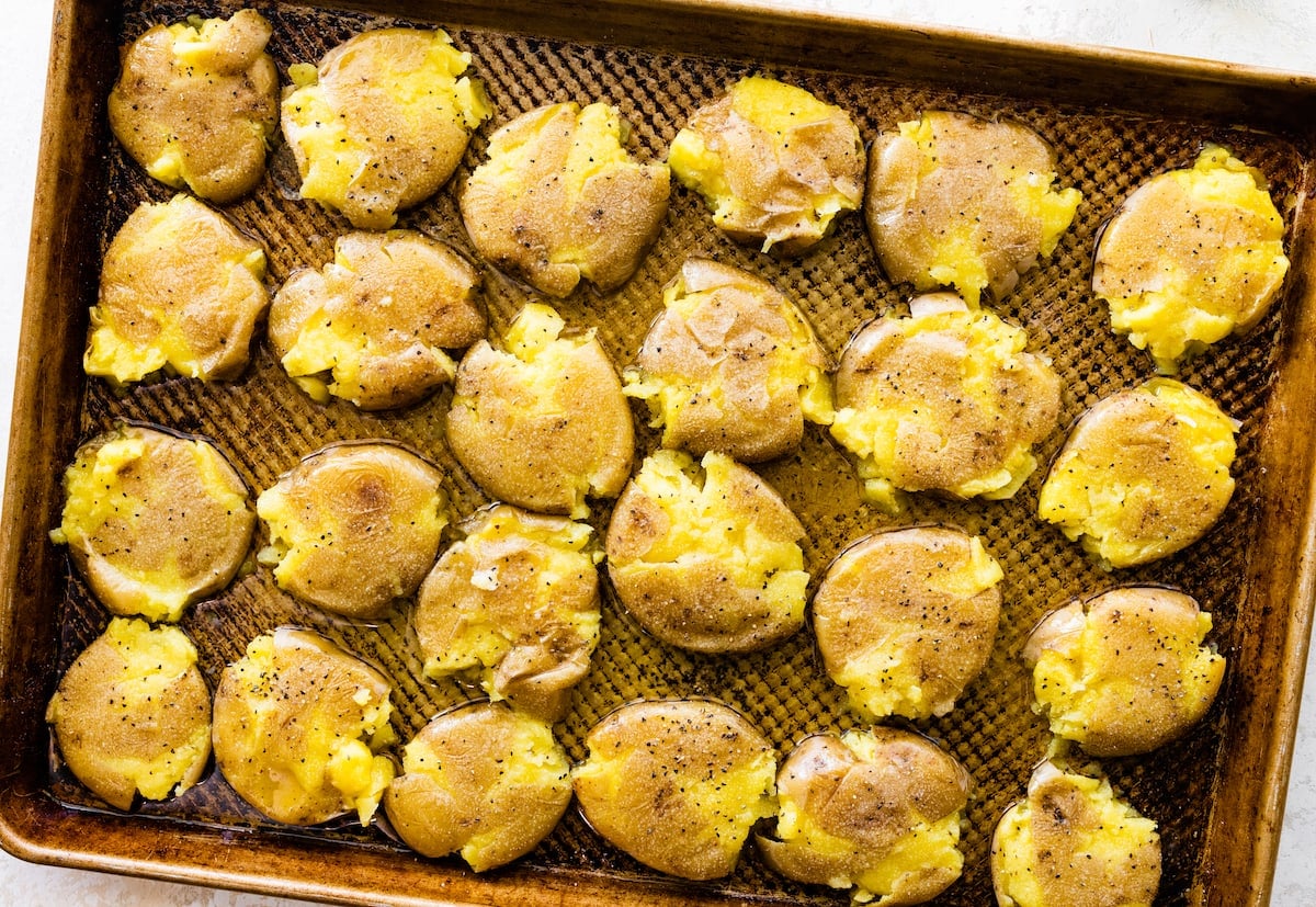 smashed potatoes on baking sheet. 