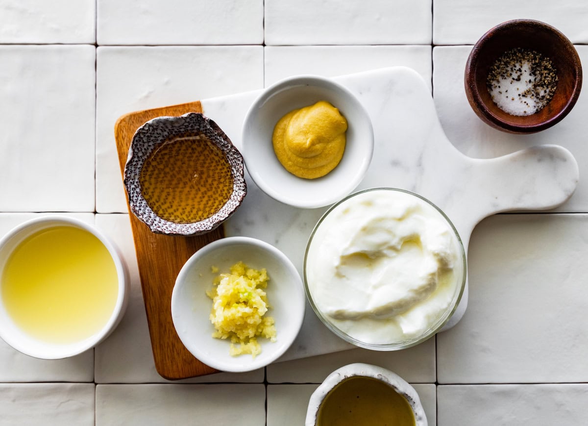 ingredients in bowls to make creamy lemon dressing. 