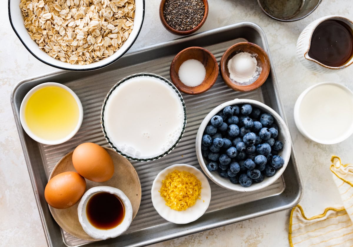 ingredients in bowls to make lemon blueberry baked oatmeal cups. 