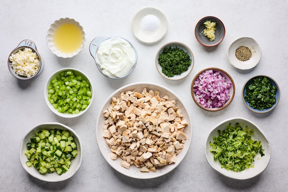 ingredients in bowls to make chicken tzatziki salad. 