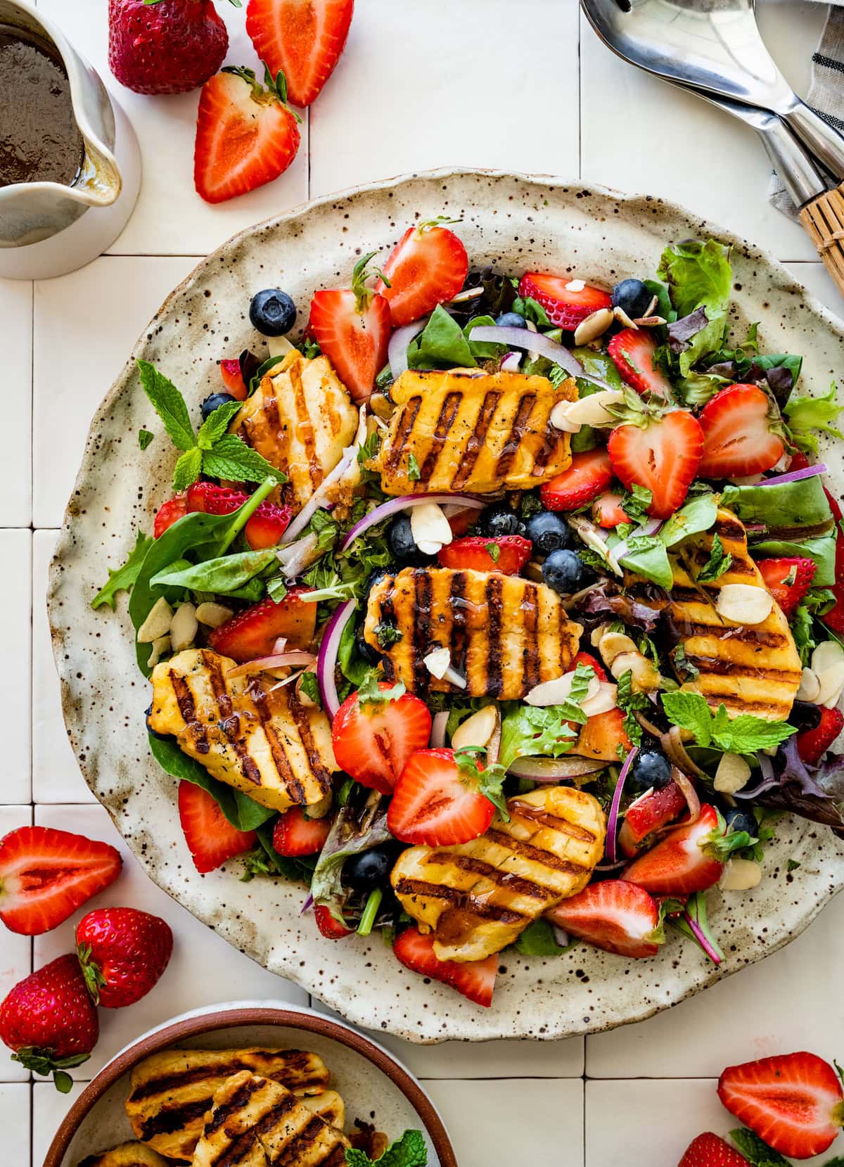 grilled halloumi berry salad on plate.