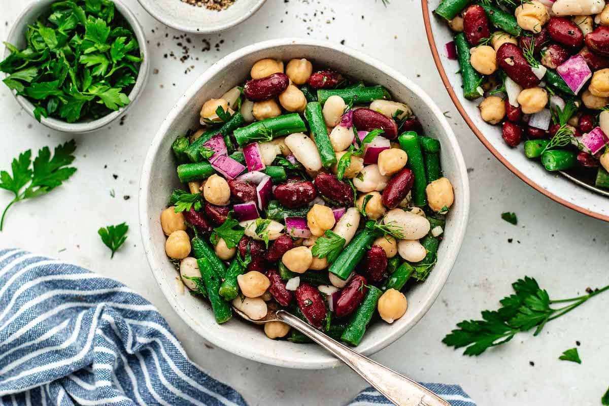 bean salad in bowl with fork. 