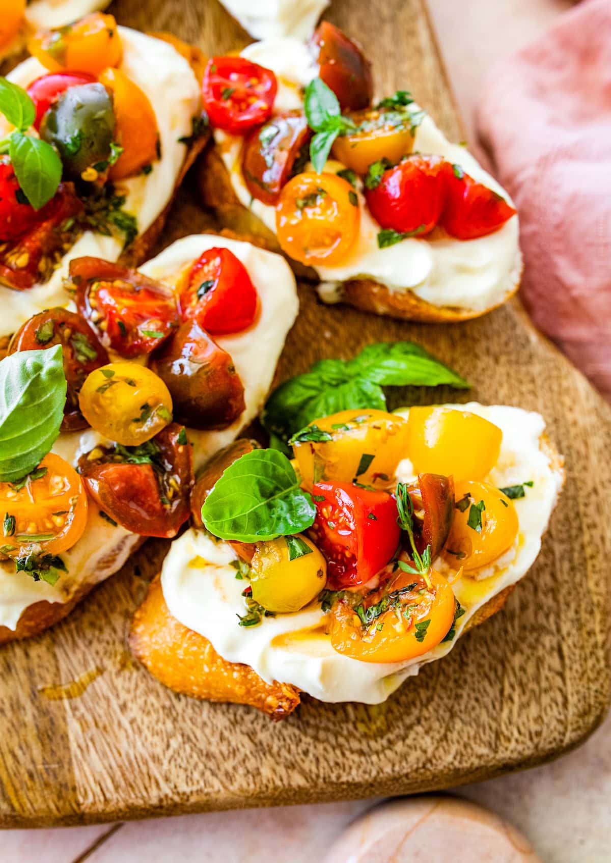 marinated tomatoes with herbs on crostini with whipped feta.