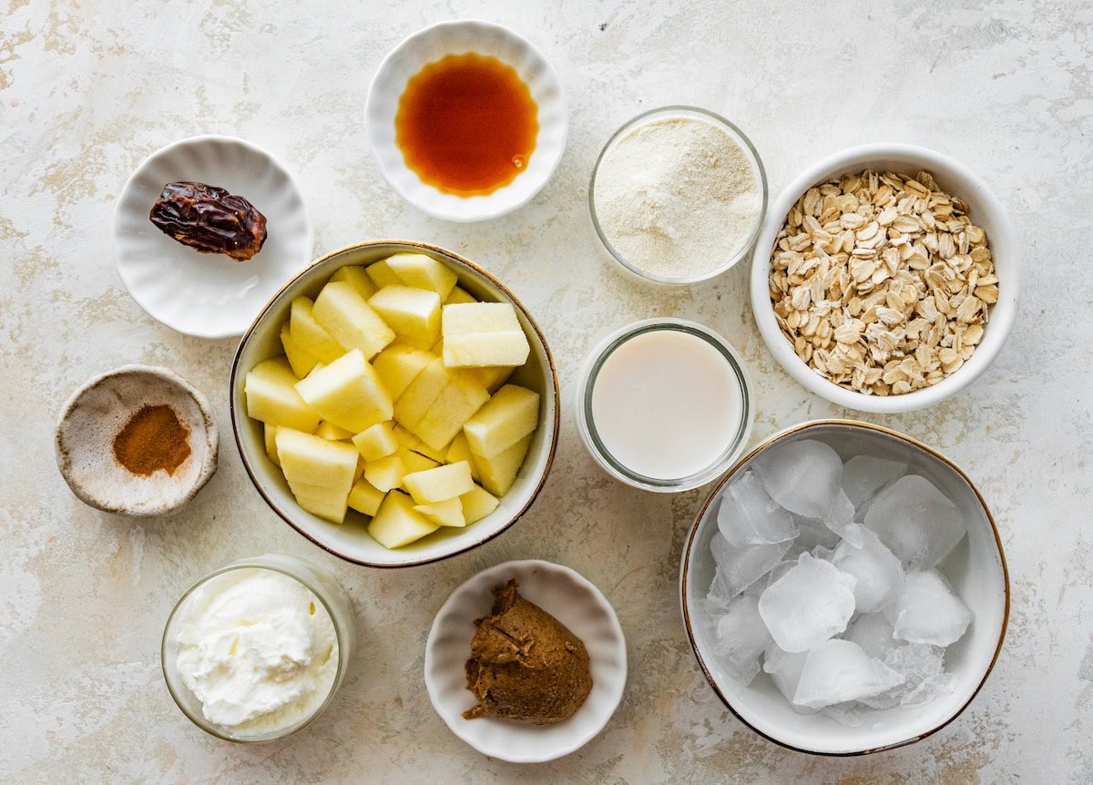 ingredients in bowls to make apple smoothie.