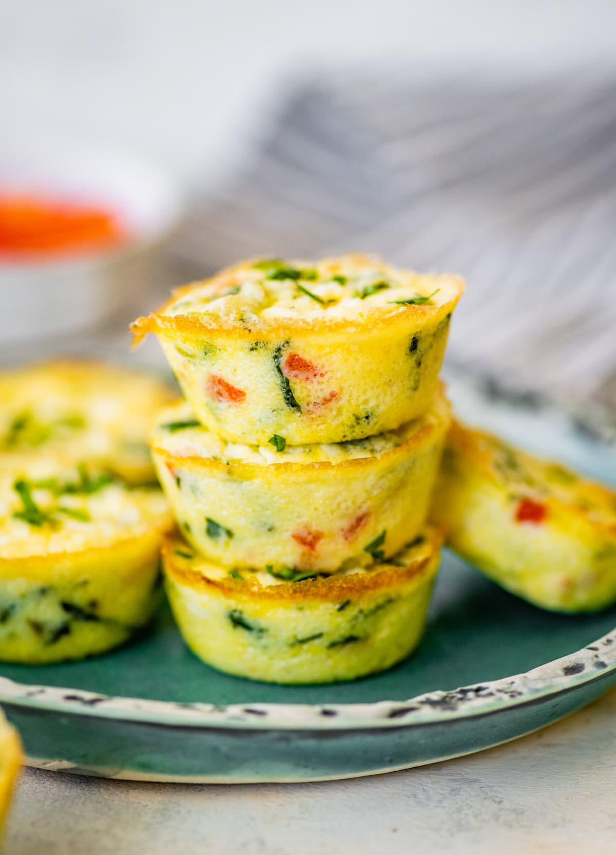 cottage cheese egg bites stacked on plate. 