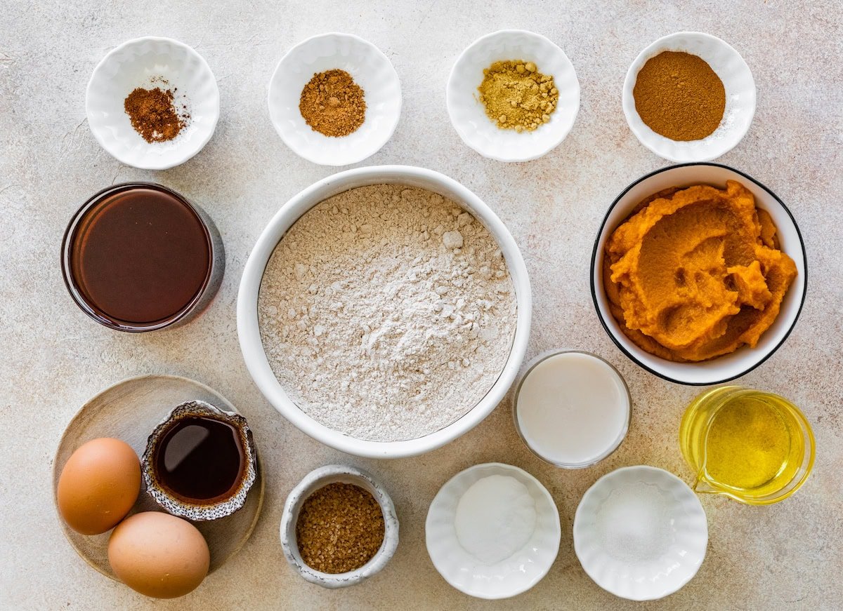 healthy pumpkin muffin ingredients in bowls. 