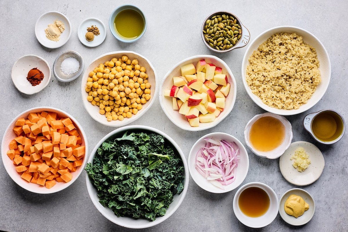 ingredients in bowls to make sweet potato kale salad.