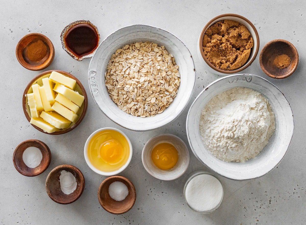 ingredients in bowls to make eggnog iced oatmeal cookies. 