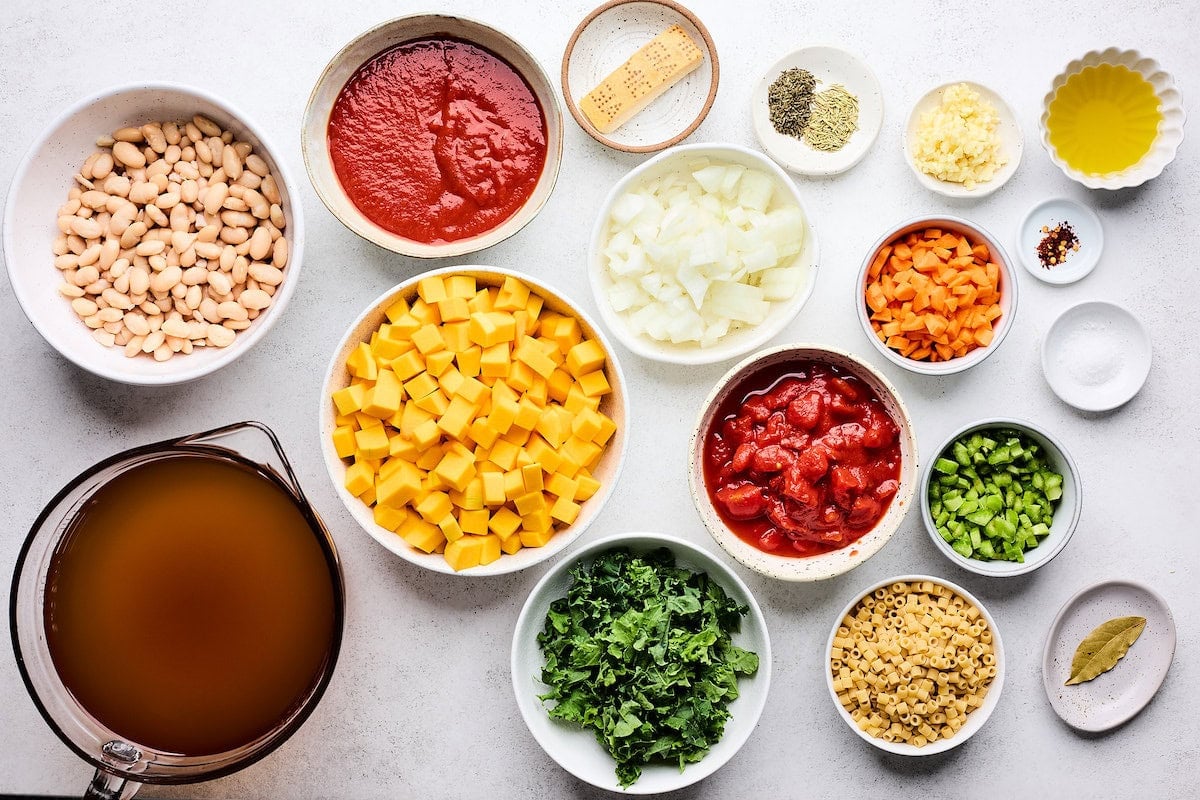 ingredients in bowls to make fall minestrone soup.