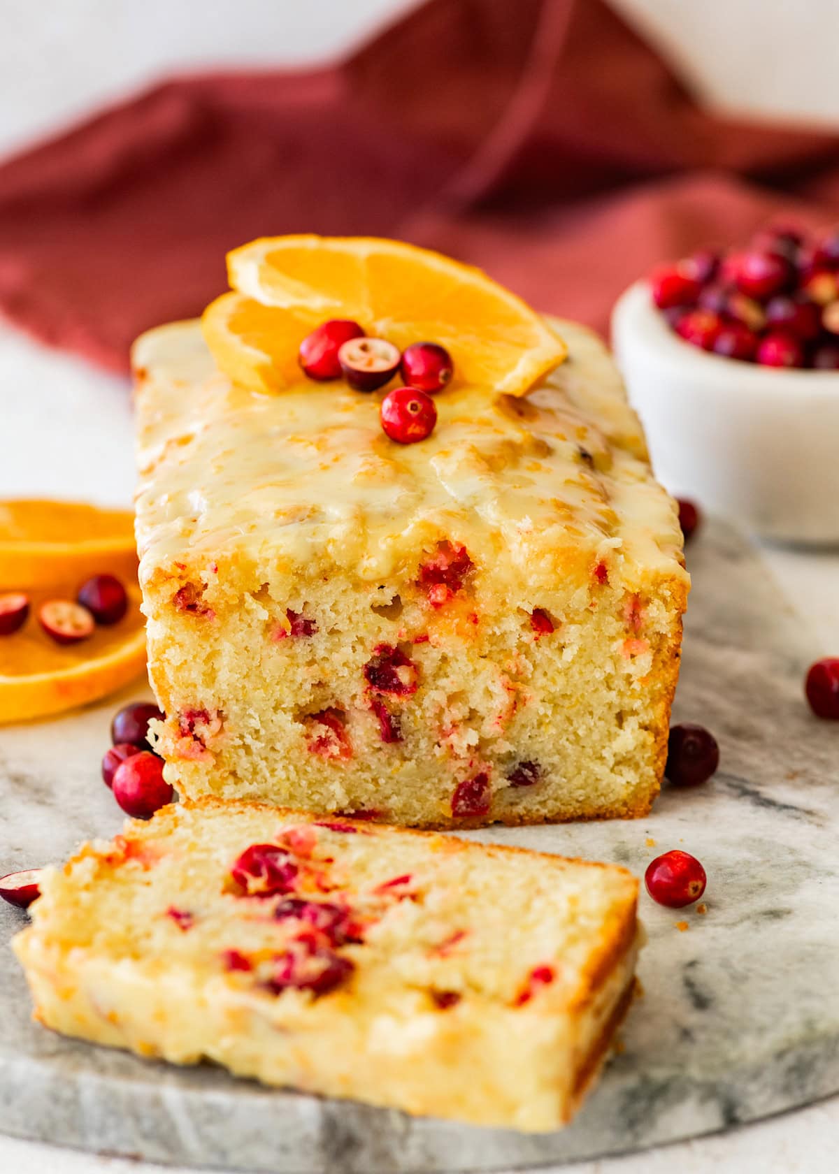 cranberry orange bread with fresh cranberries and orange glaze. 
