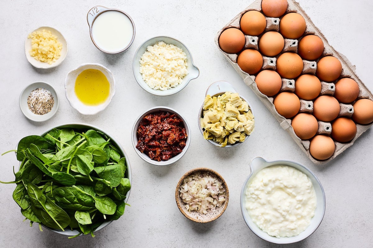 ingredients to make Spinach Artichoke Sun-Dried Tomato Breakfast Casserole.
