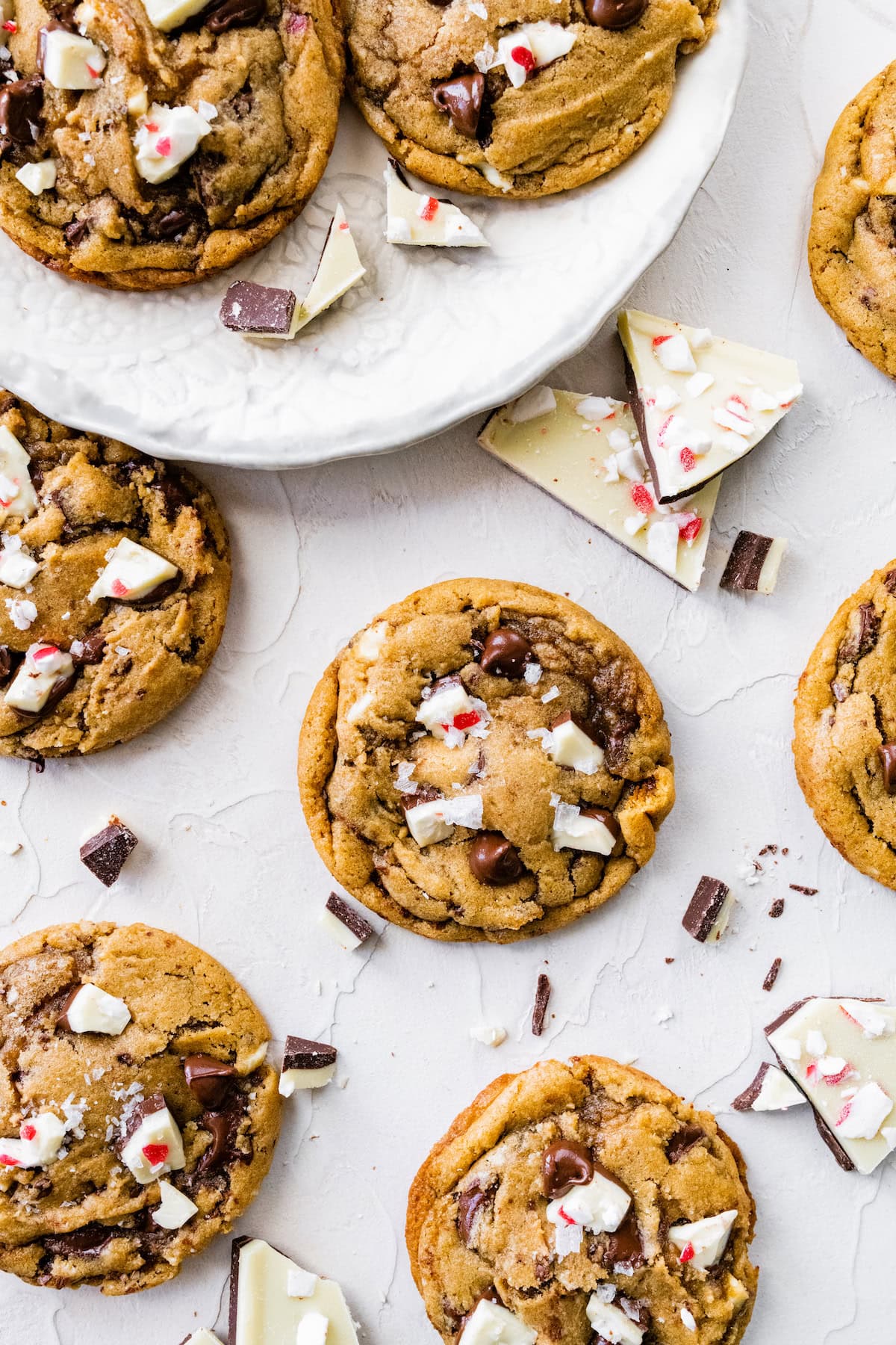 peppermint bark chocolate chip cookies on plate and off plate. 