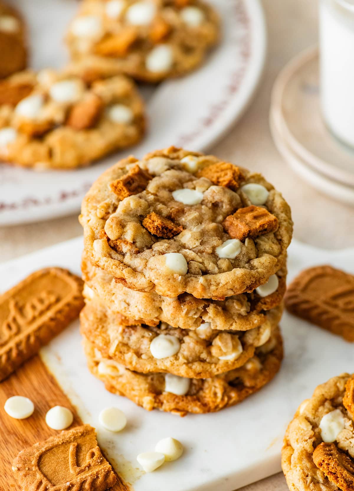 stack of brown butter biscoff oatmeal cookies with toffee and white chocolate chips.