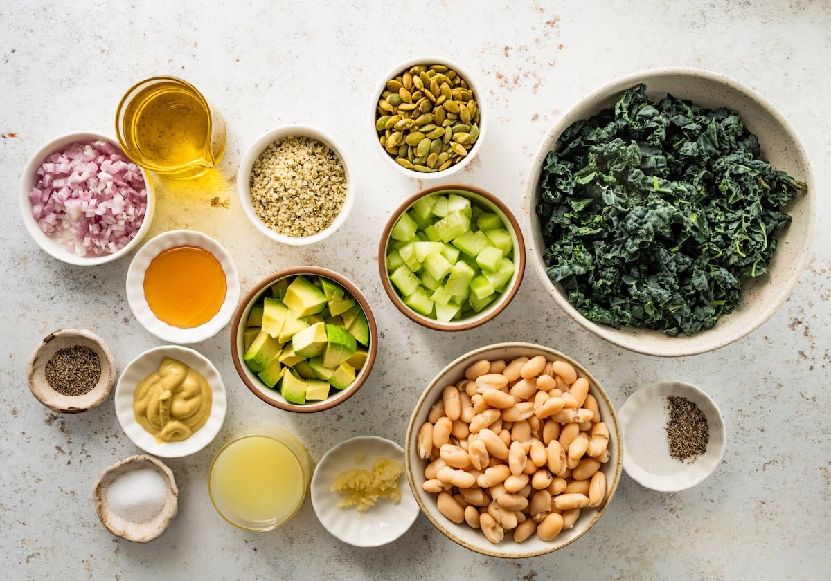 ingredients in bowls to make kale and white bean salad. 