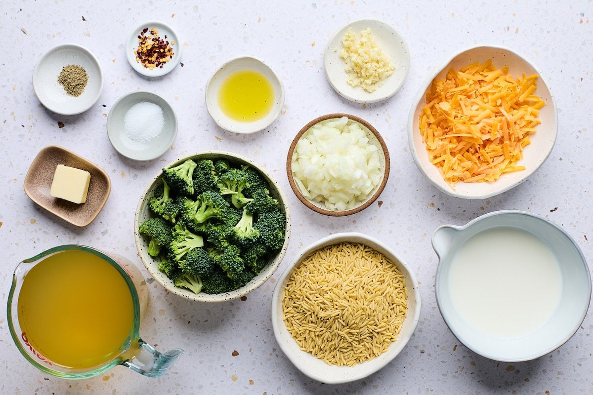 ingredients in bowls to make broccoli cheddar orzo.