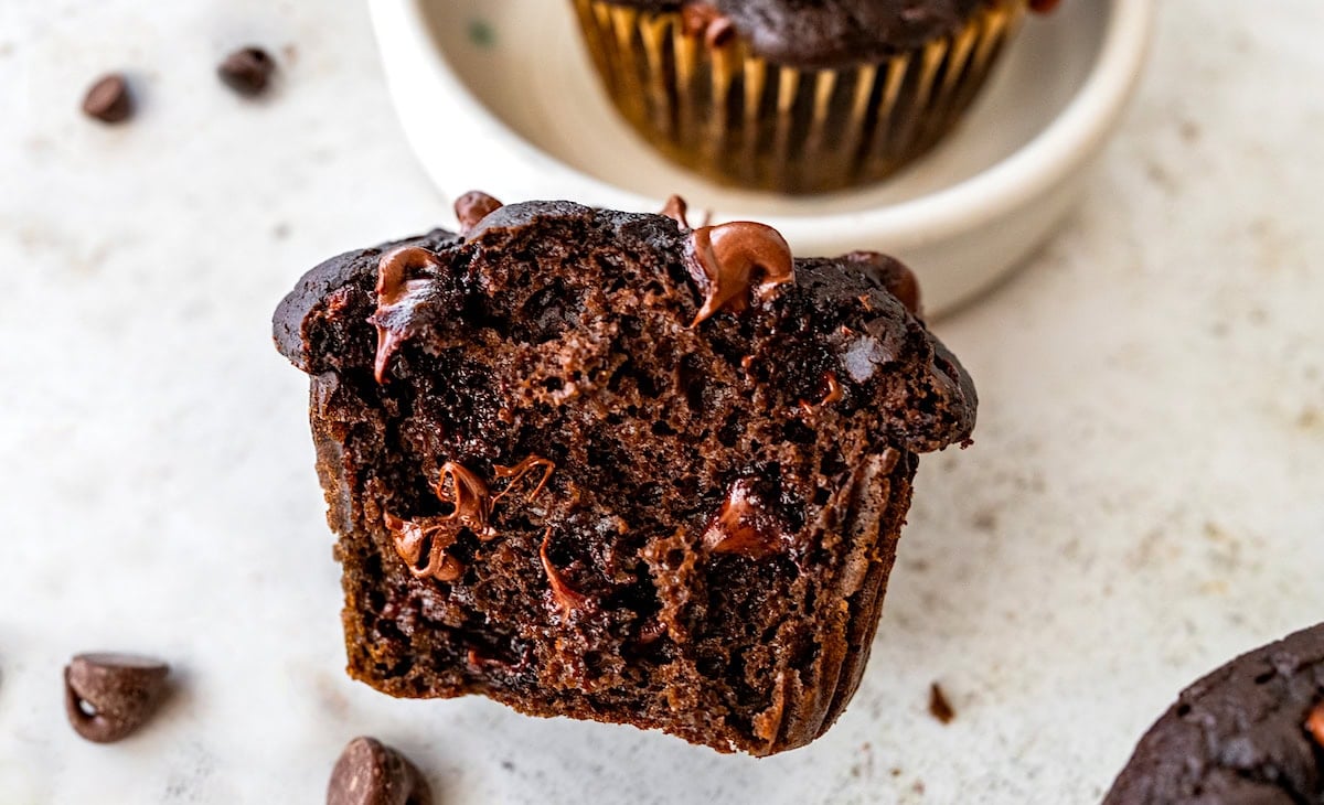 close up of half of a healthy chocolate vegetable muffin.