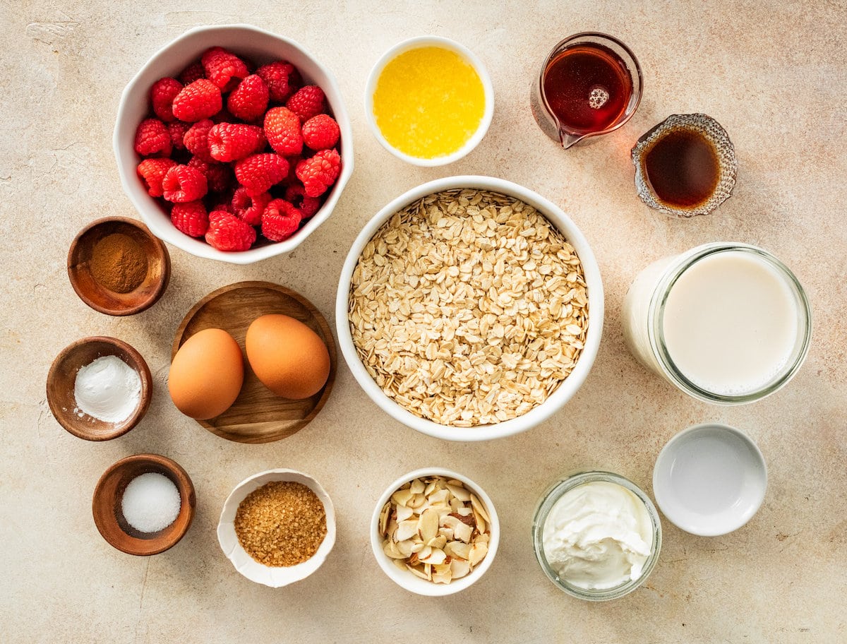 ingredients in bowls to make raspberry baked oatmeal.