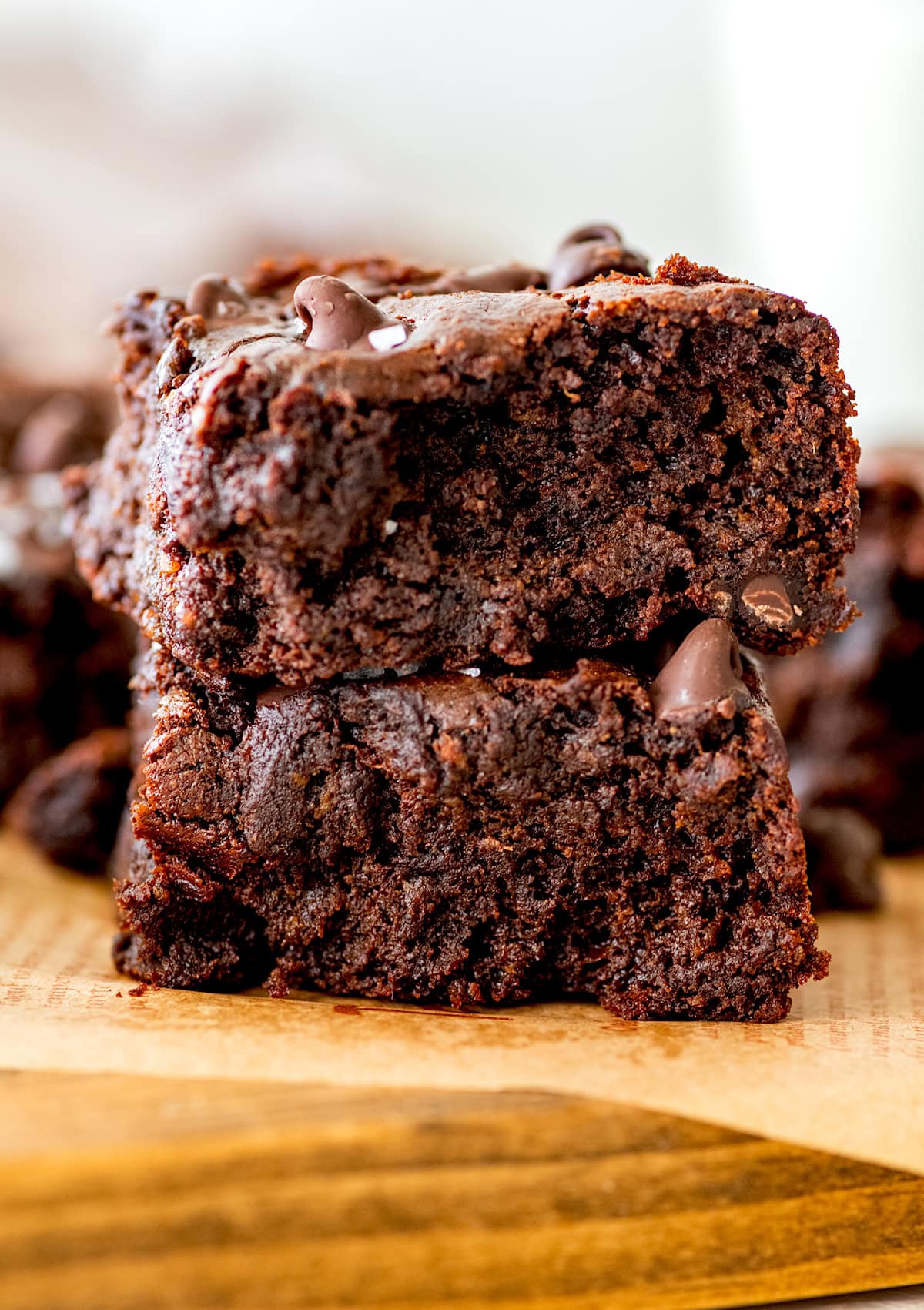 two flourless sweet potato brownies stacked on top of each other.