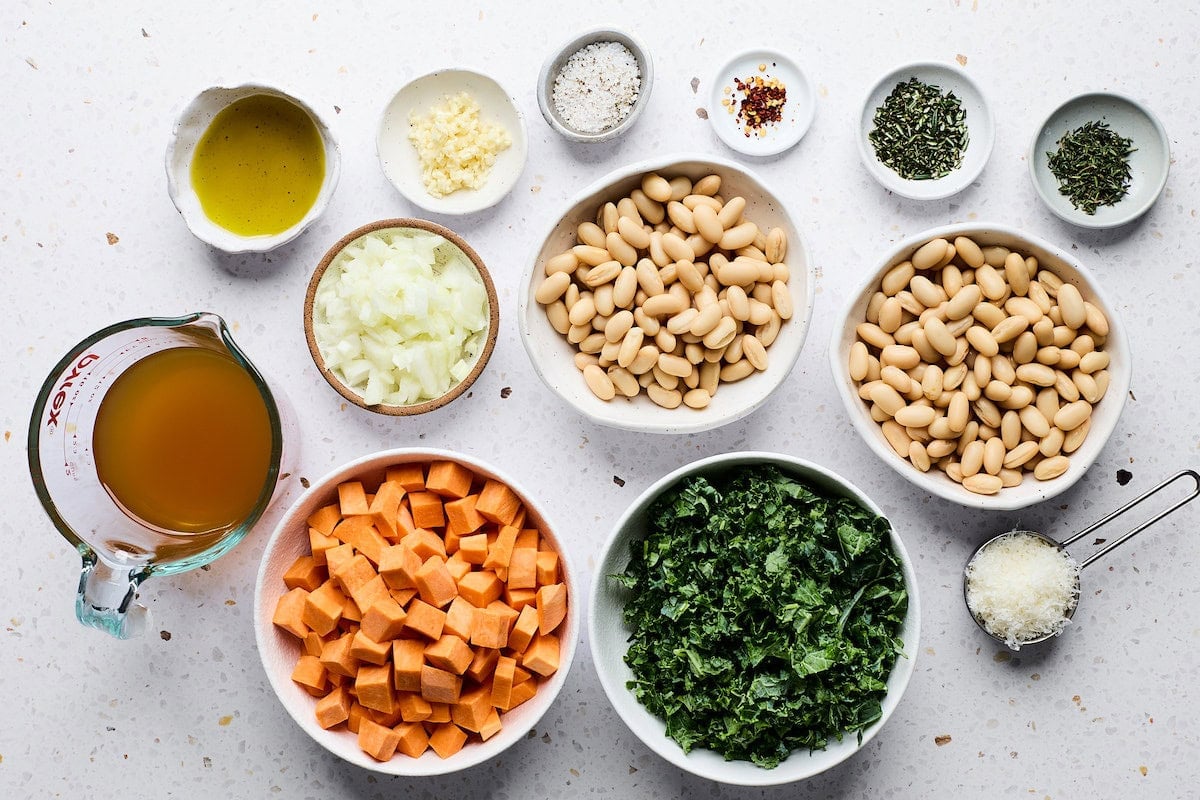 Ingredients in bowls to make sweet potato white bean skillet.