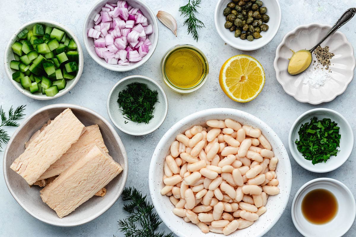 ingredients in bowls to make tuna white bean salad.
