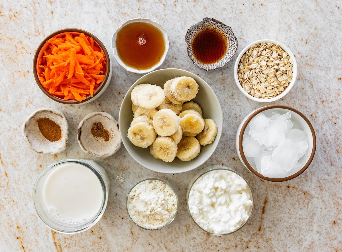 ingredients in bowl to make carrot cake smoothie.