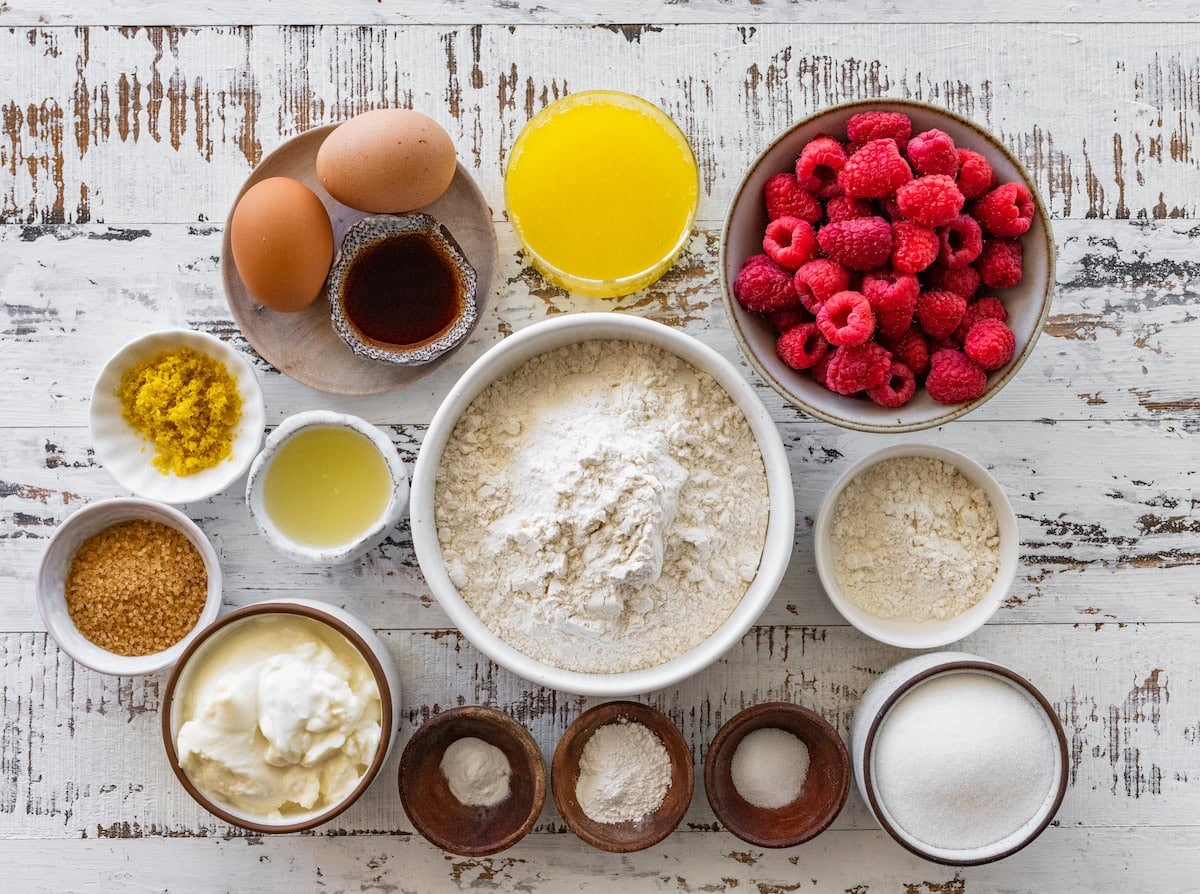 ingredients in bowls to make raspberry lemon ricotta muffins.