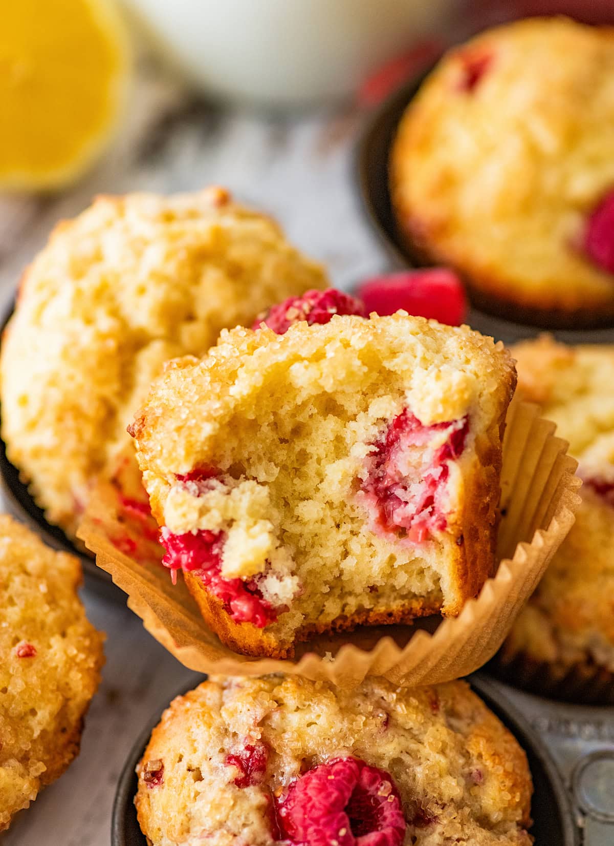 close up of inside of raspberry lemon ricotta muffin.