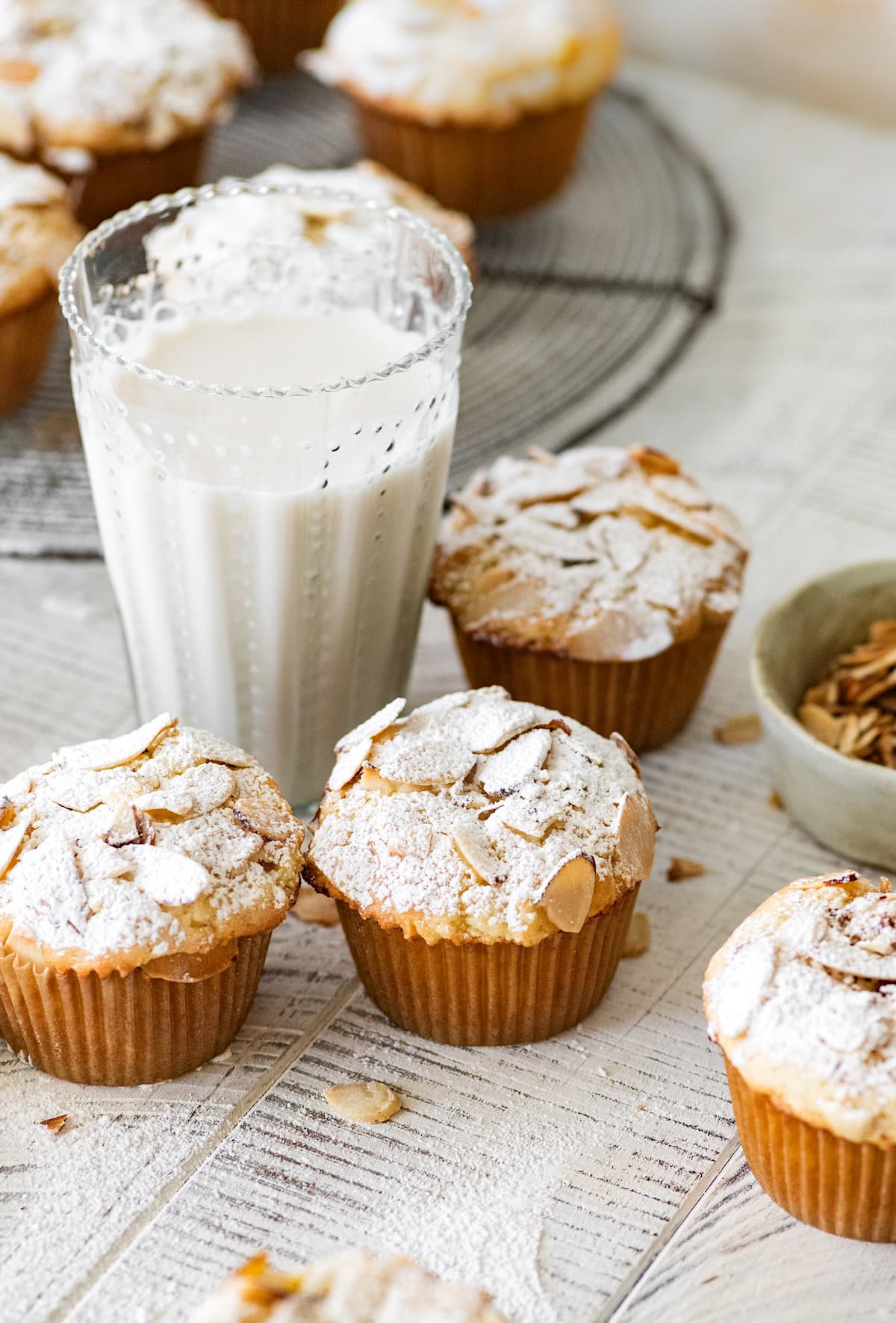 almond croissant muffins with a glass of milk.