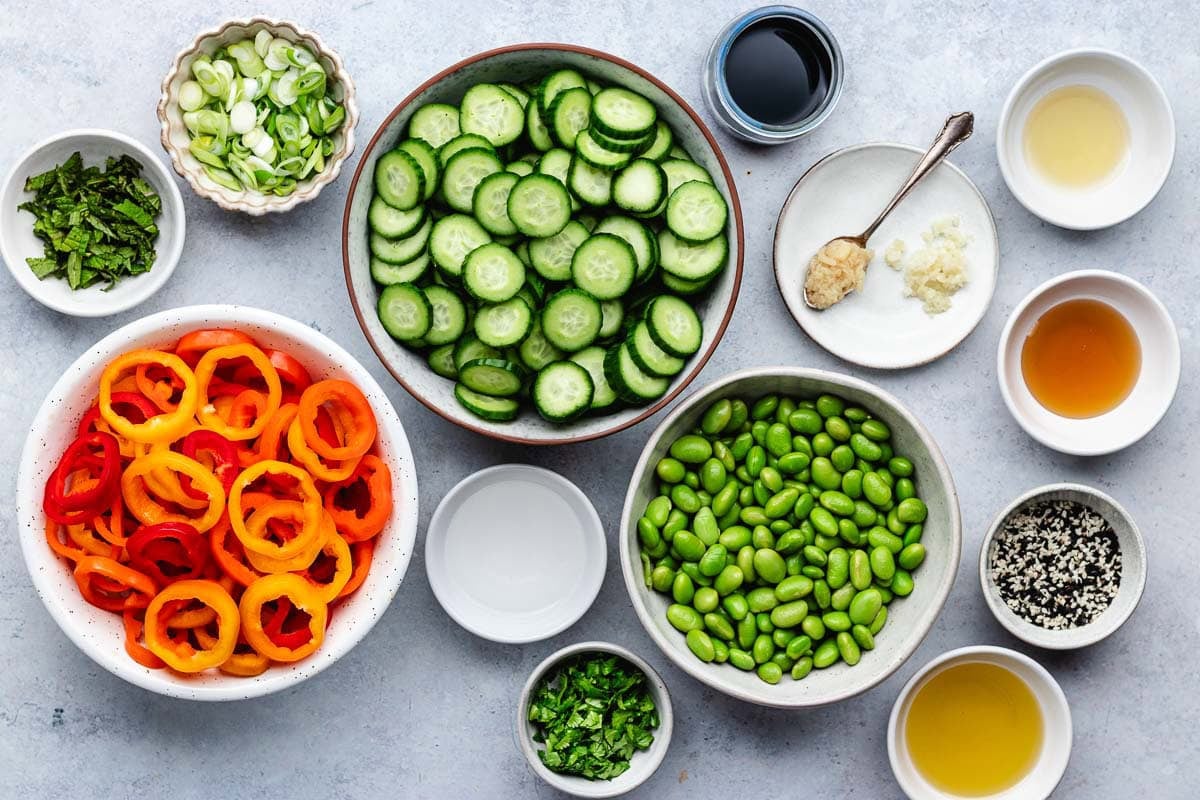 ingredients in bowls to make cucumber sweet pepper salad.
