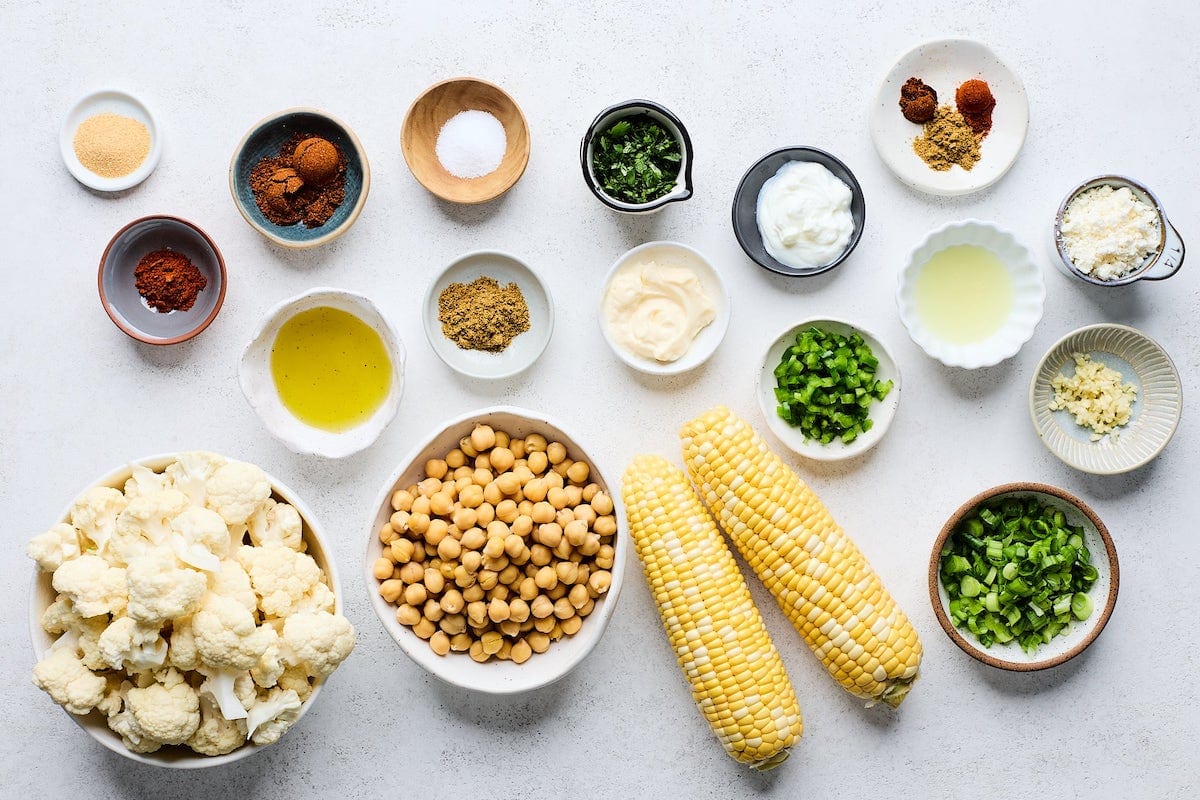 ingredients in bowls to make roasted cauliflower street corn tacos.