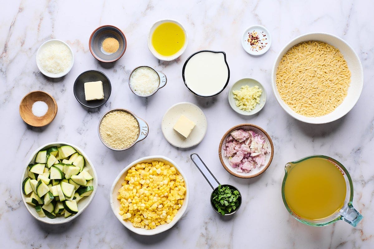 ingredients to make corn and zucchini orzo.