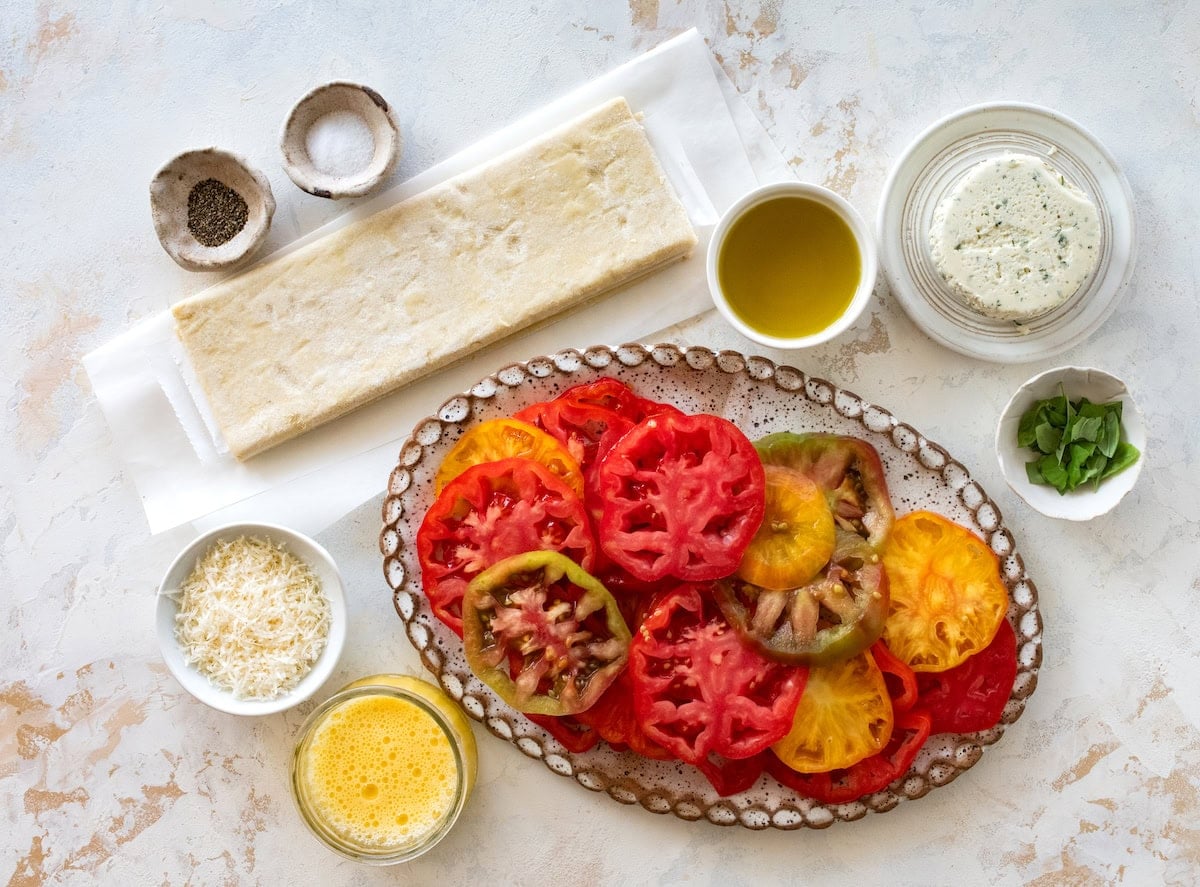 ingredients to make tomato tart with puff pastry.