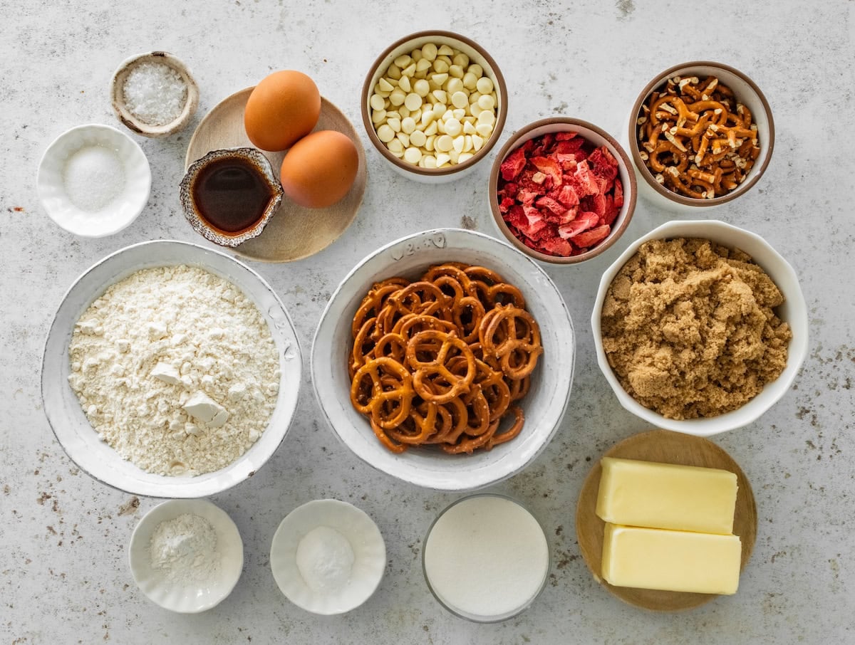 ingredients in bowls to make strawberry pretzel cookies.