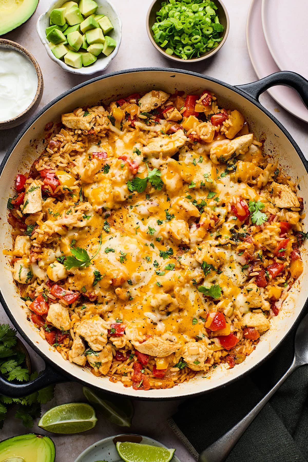 chicken fajita skillet with melty cheese and cilantro.