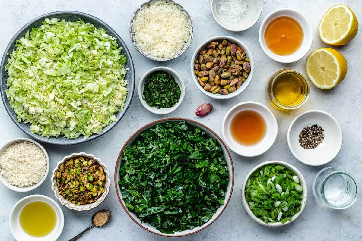 ingredients in bowls to make crunchy kale salad.