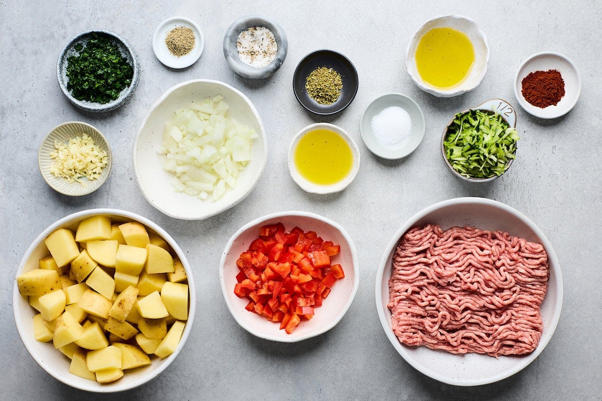 ingredients in bowls to make Greek ground turkey bowls.