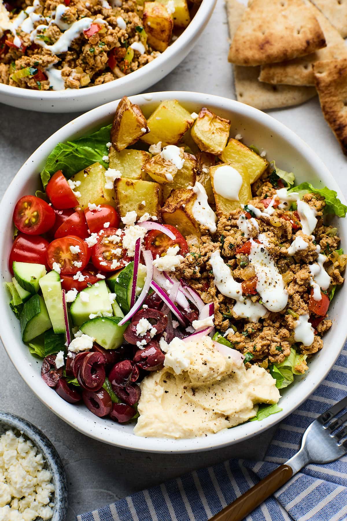 Greek ground turkey bowl with toppings.