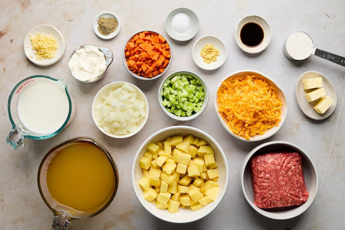 ingredients in bowls to make cheeseburger soup.