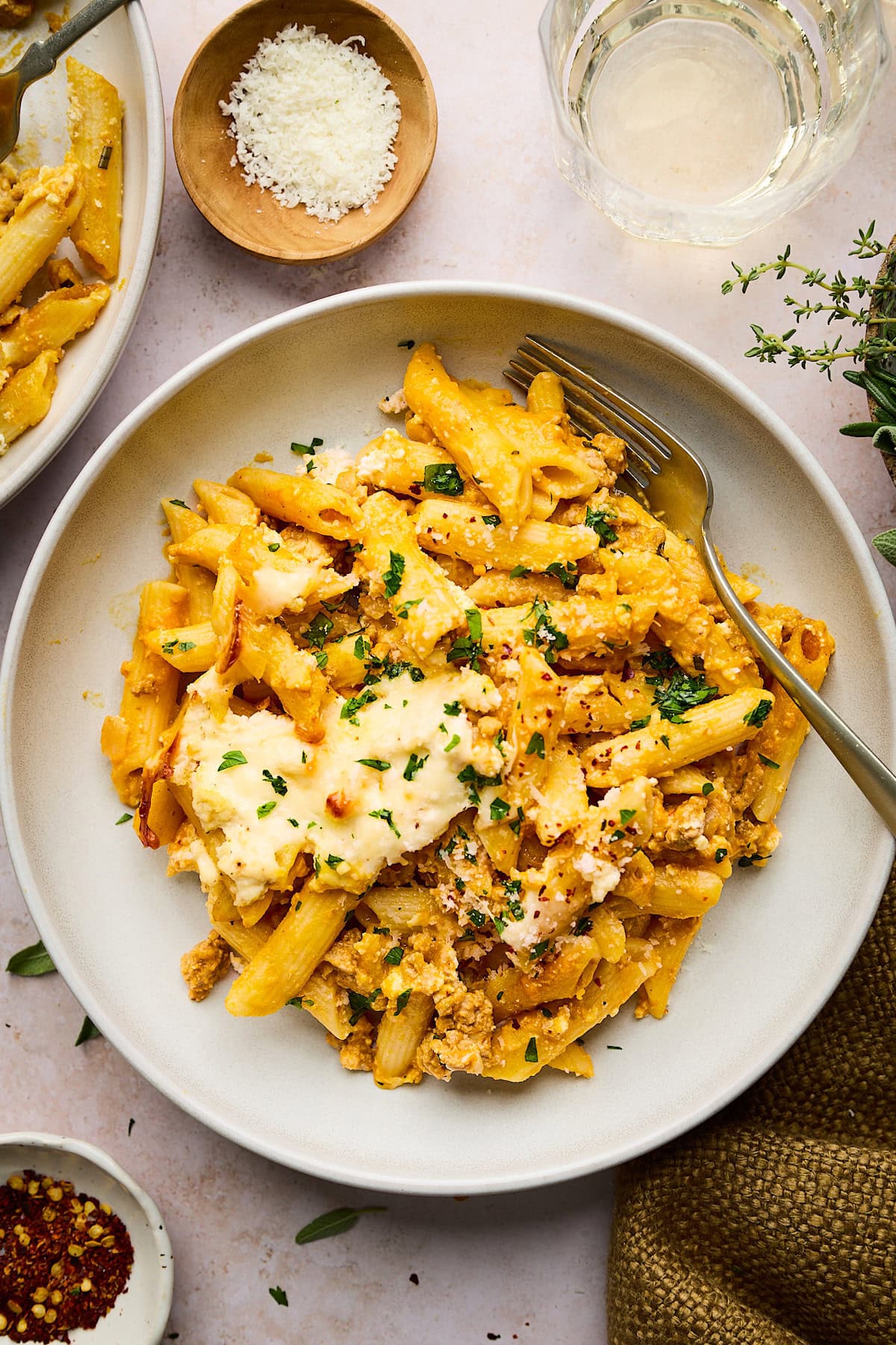 turkey pumpkin pasta bake on plate with fork.